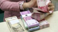 RUPIAH KAMIS SORE MELEMAH MENJADI RP11.439