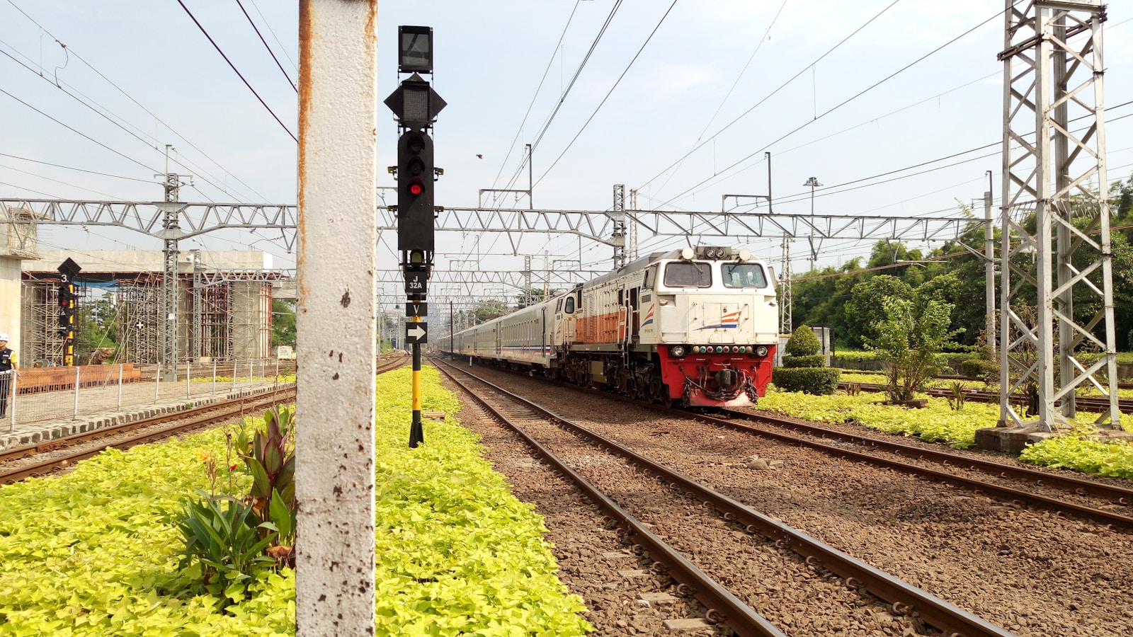 red and white train on rail tracks